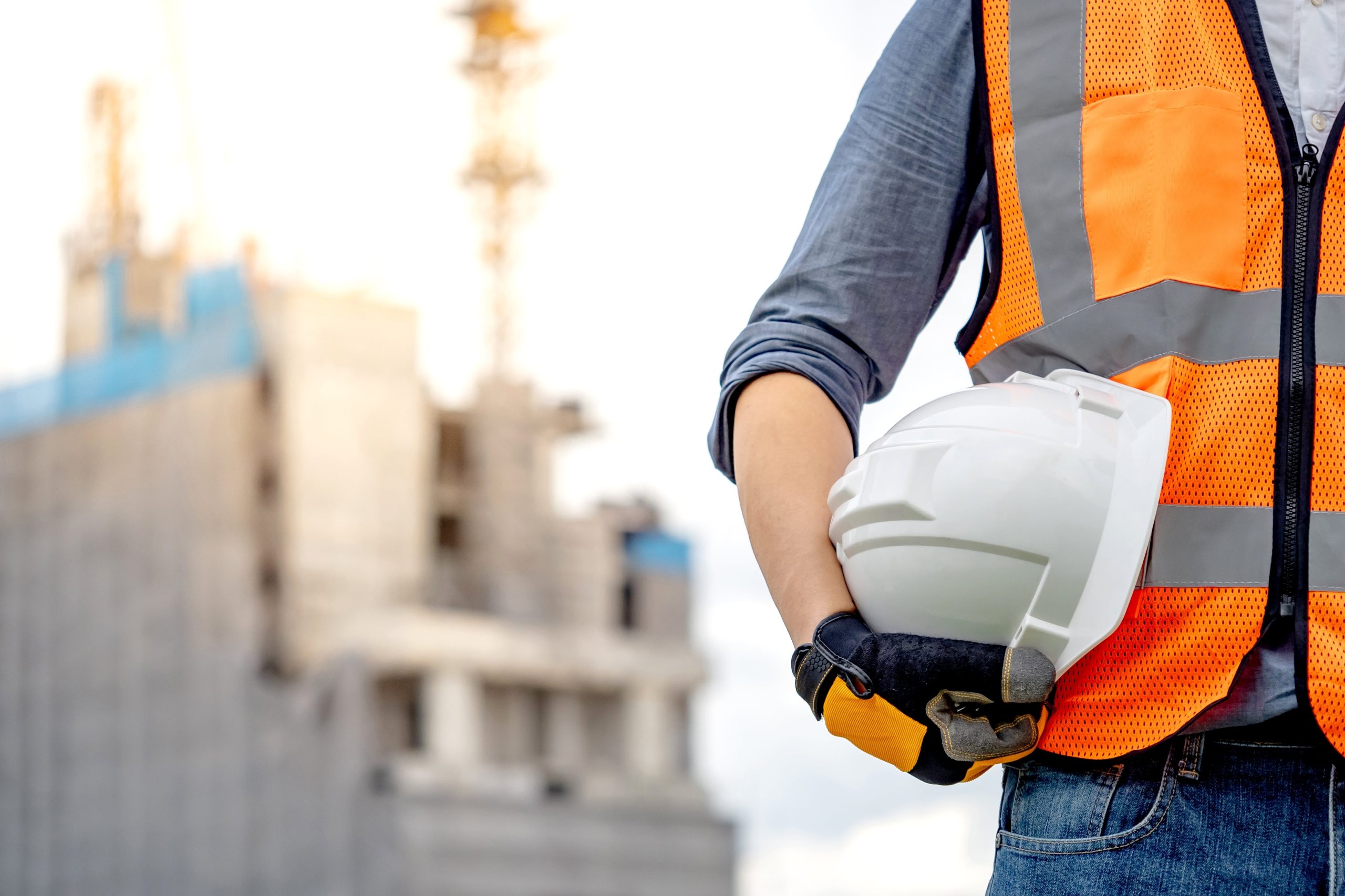 Man holding constructor worker helmet